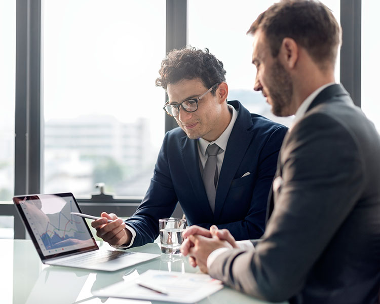 Businessmen reviewing charts image