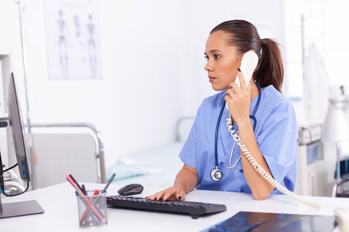 Medical nurse talking with patient on phone about diagnosis-Image